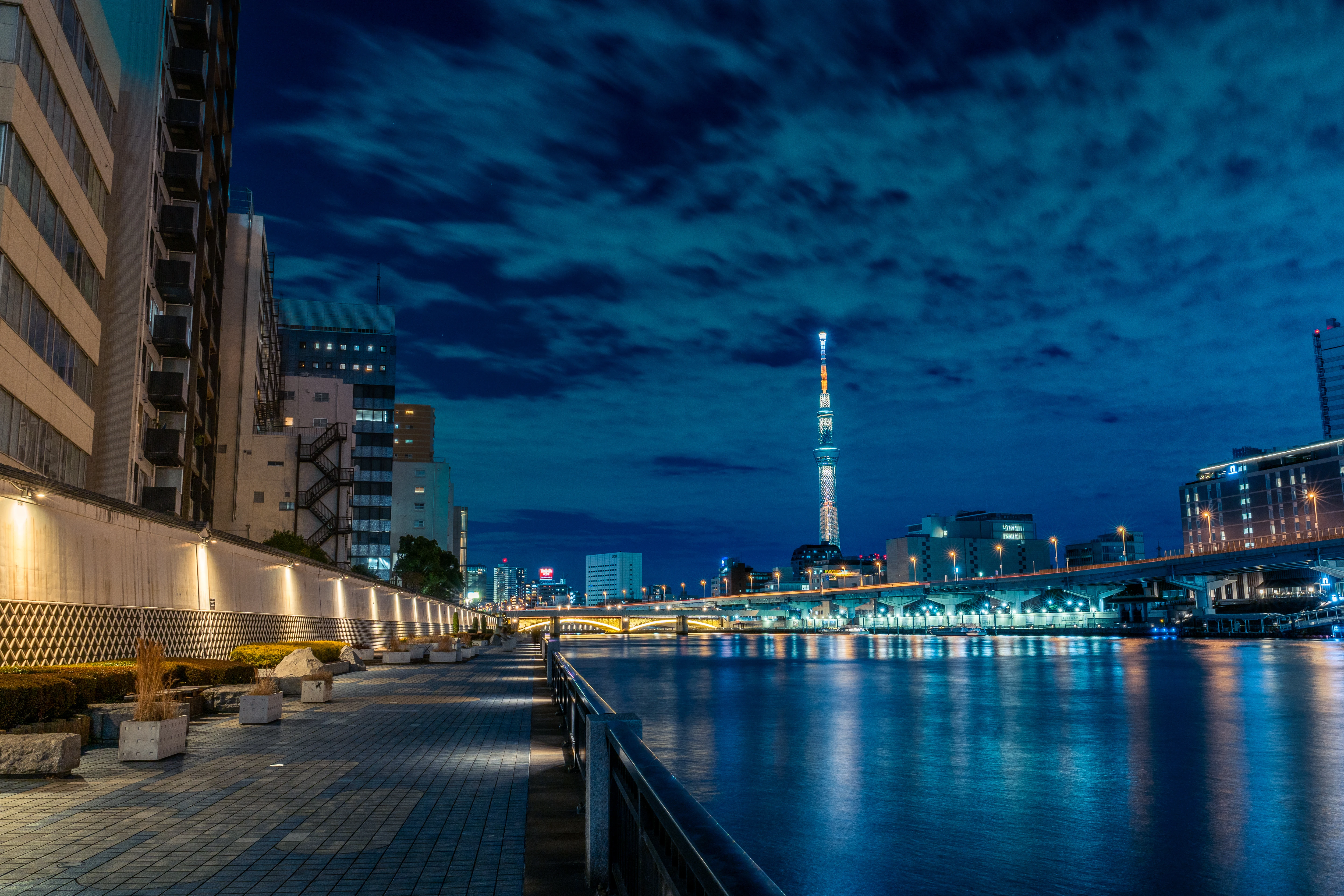 Illuminated Tokyo Sky: Serene Nightscape by the Sumida River